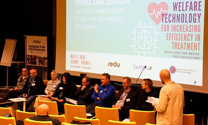 People in a panel discussion in the ECWT conference.